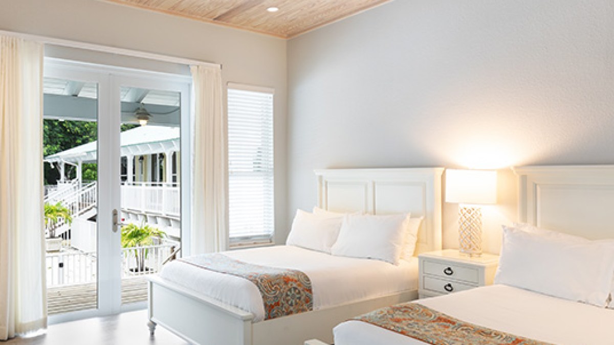 a bedroom with a large bed in a room