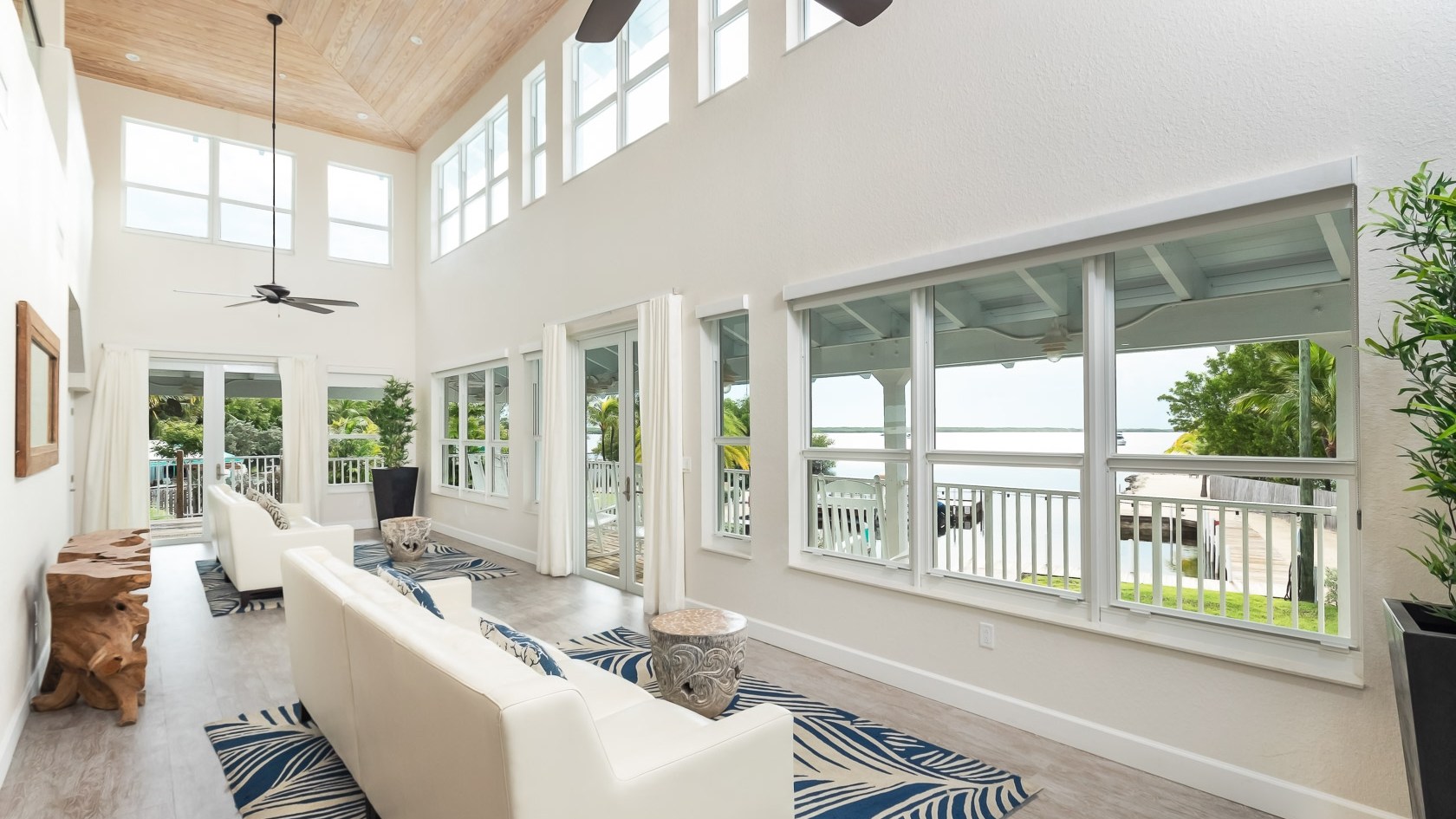 a living room filled with furniture and a large window