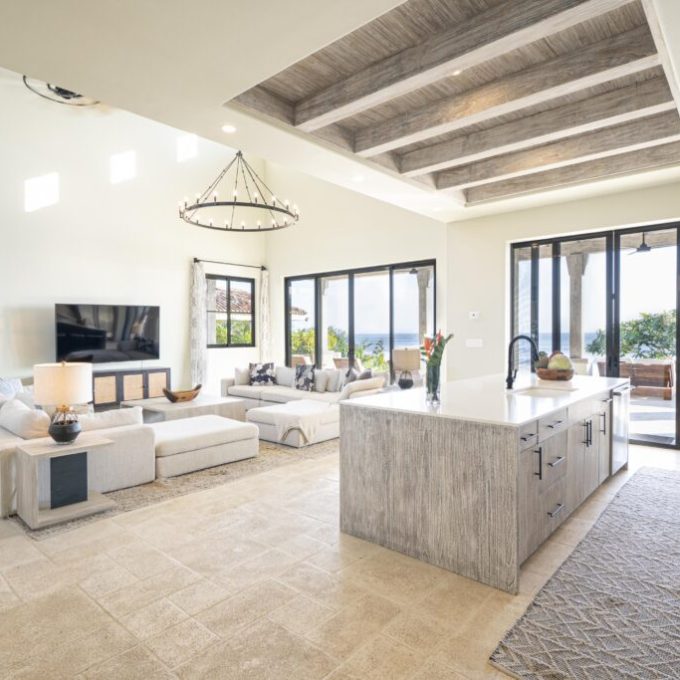 a living room filled with furniture and a large window