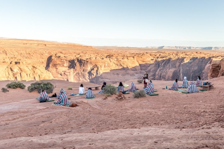 a group of people in a desert
