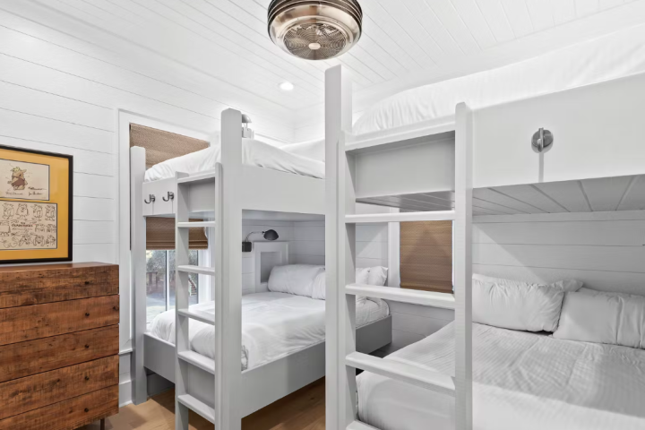 a bedroom with a bed in a room