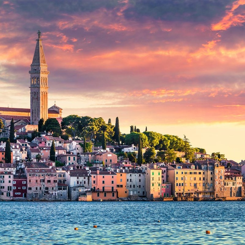 a large body of water with a city in the background