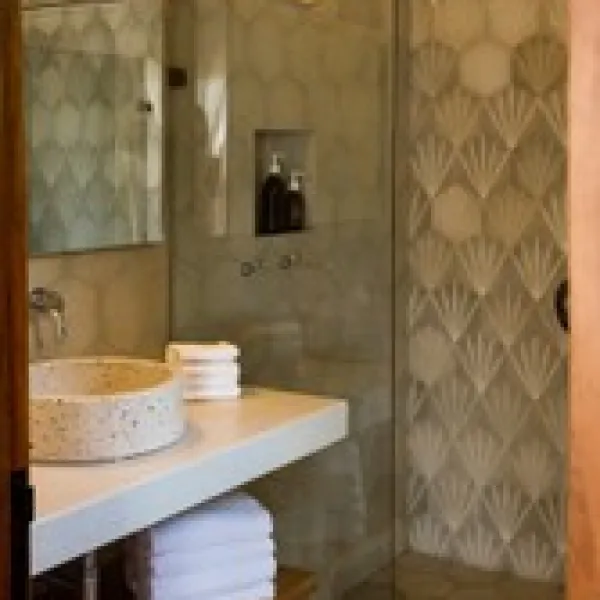 a room with a sink and a mirror