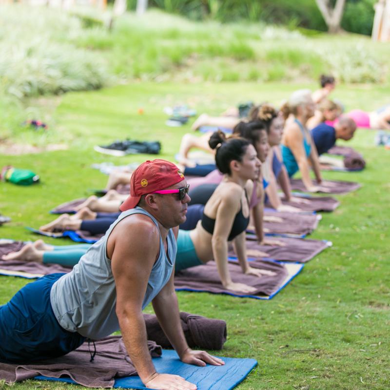 a group of people sitting at a park