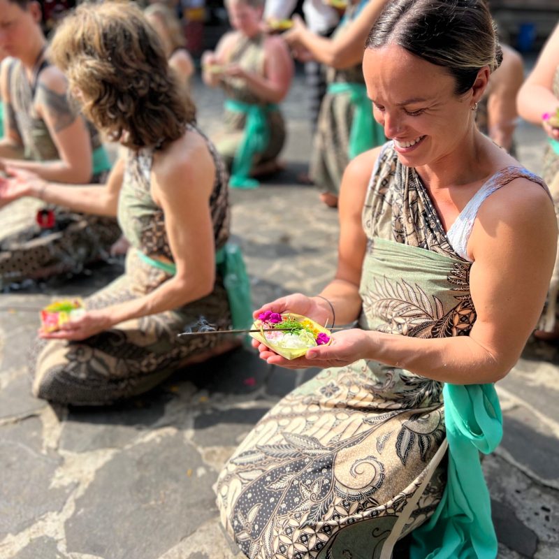 a group of people sitting at a zoo