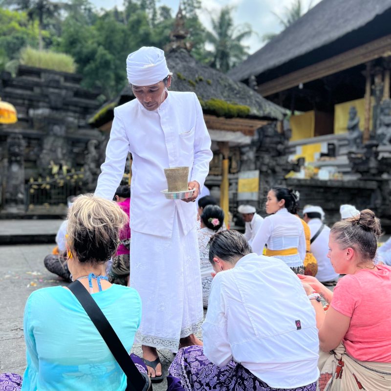 a group of people around each other