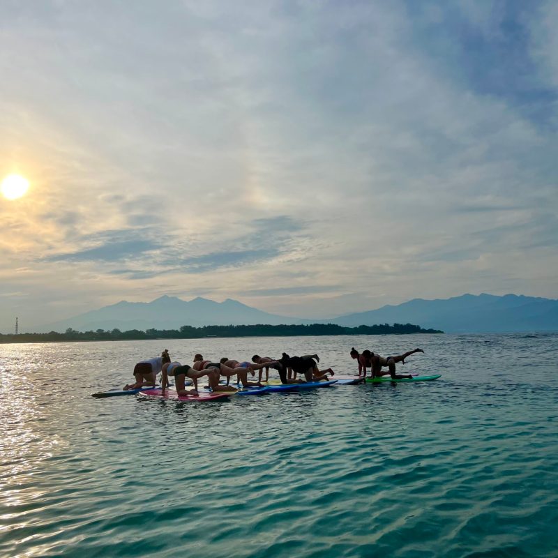a group of people in a boat on a body of water