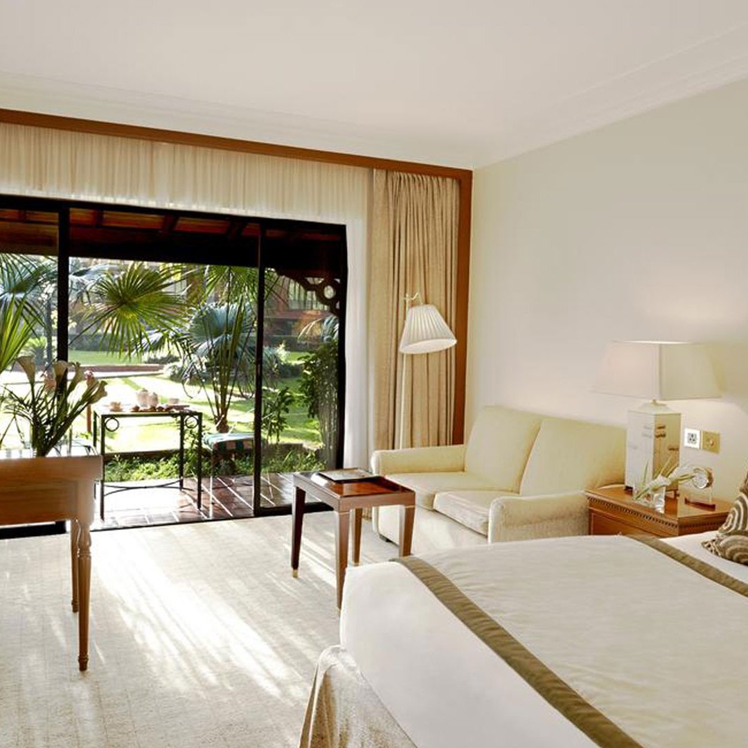 a living room filled with furniture and a large window