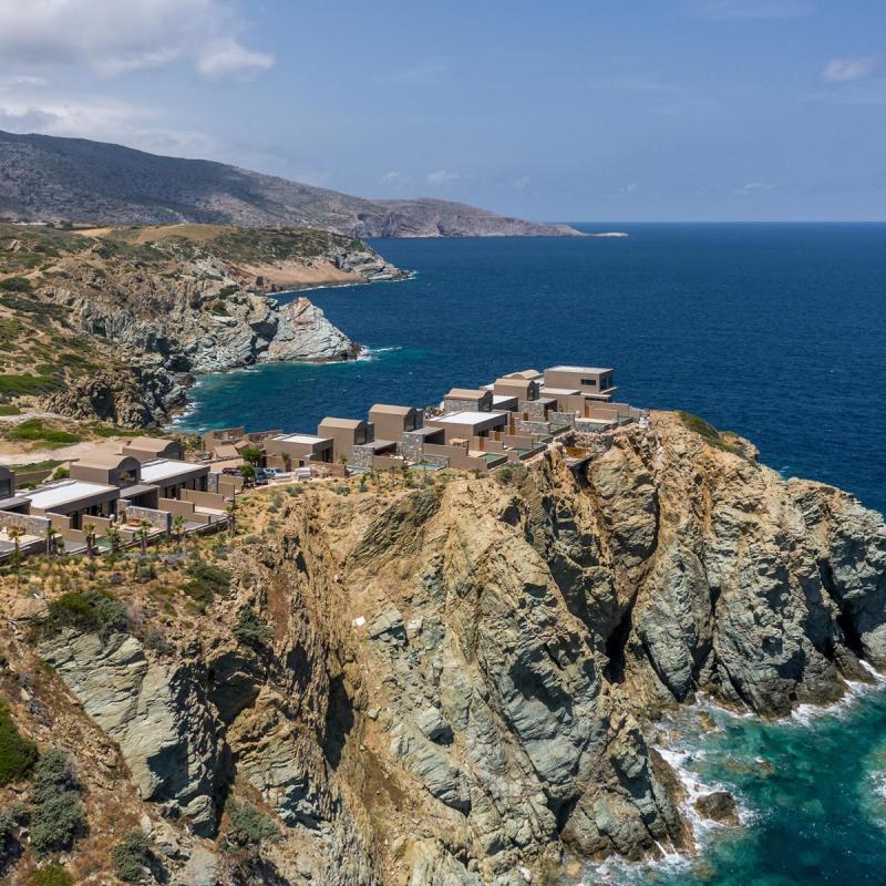 a body of water with a mountain in the background