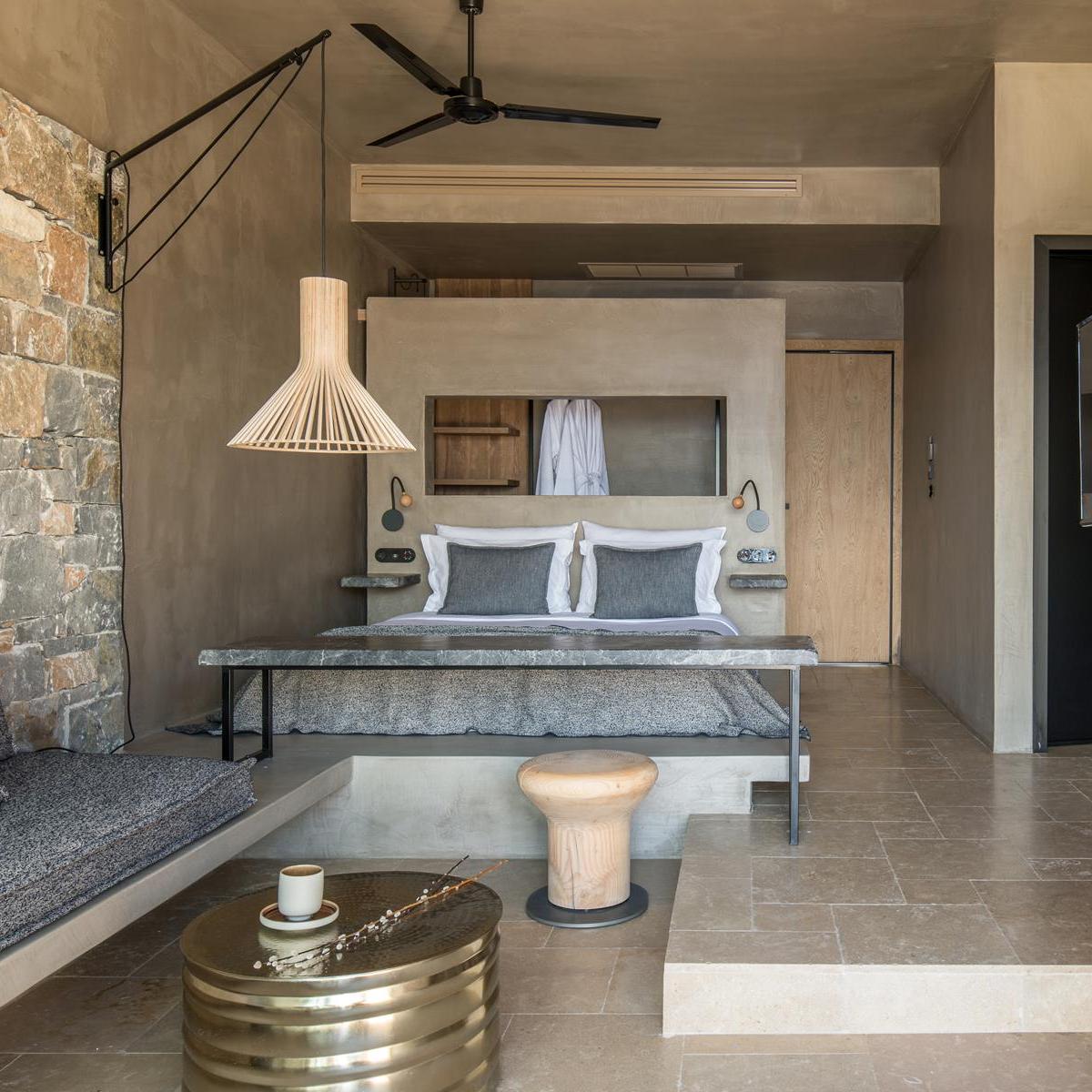 a stone building that has some furniture in it