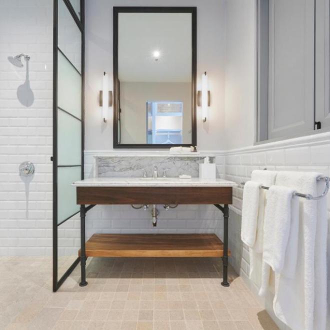 a room with a sink and a mirror