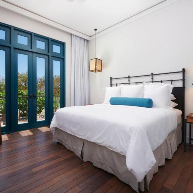 a bedroom with a large bed in a hotel room