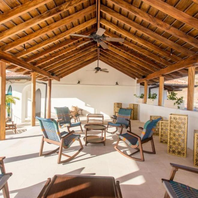 a room filled with furniture on top of a wooden chair