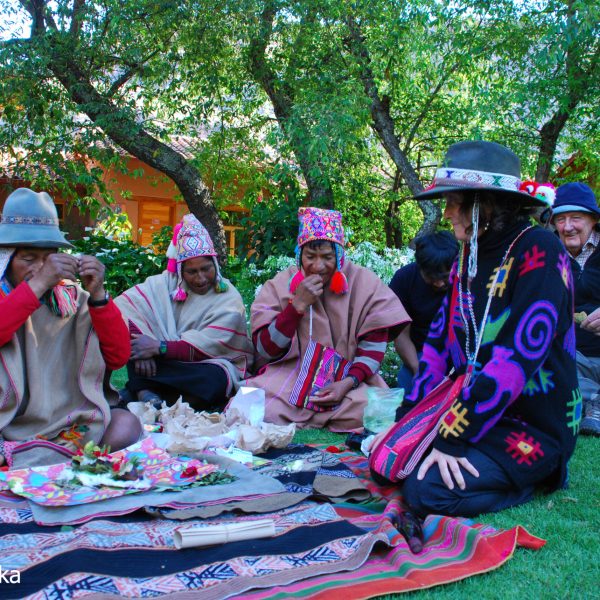 a group of people sitting at a park