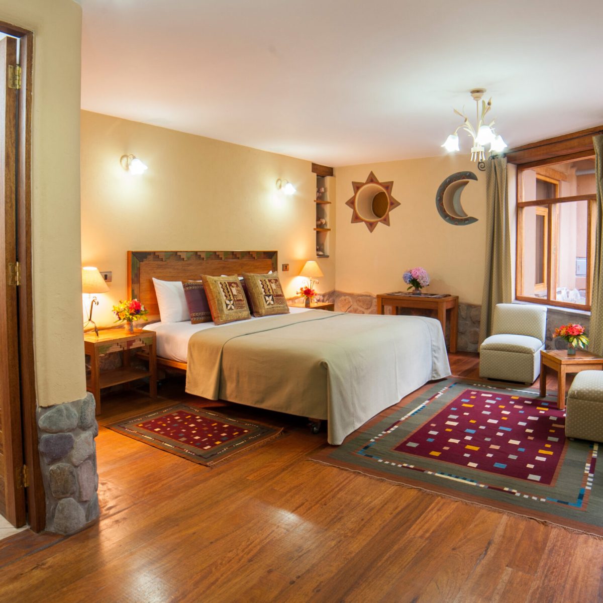 a view of a living room filled with furniture and a large window