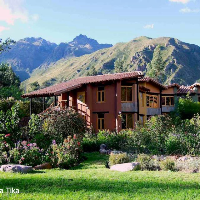 a house with a mountain in the background