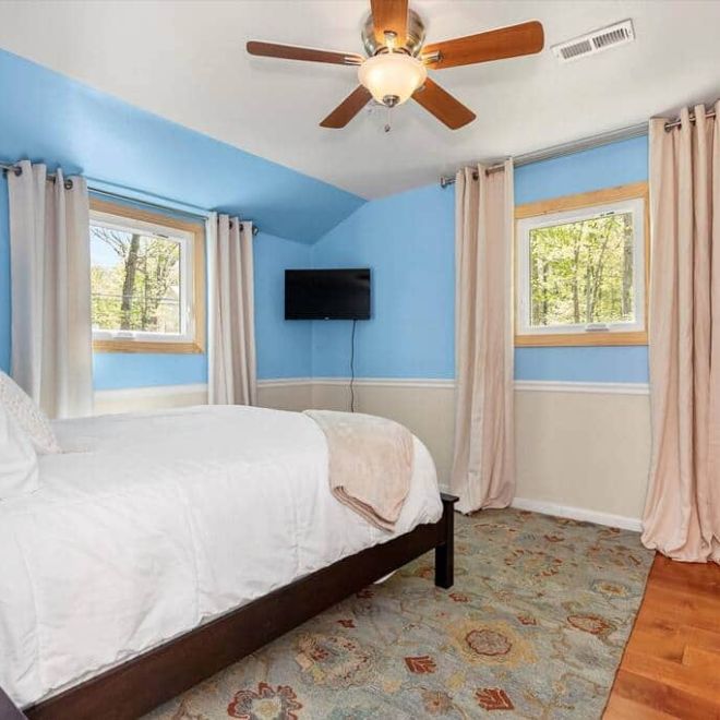 a bedroom with a large bed in a room