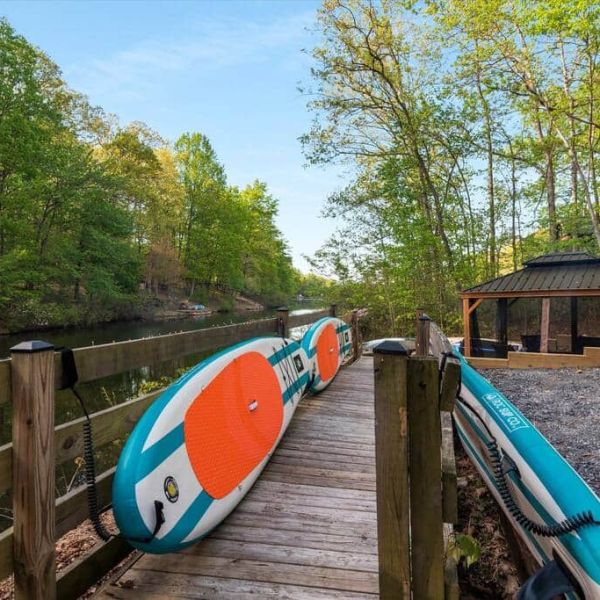 a boat sitting on top of a wooden fence