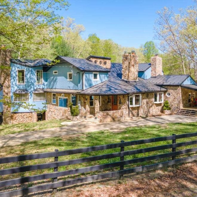a house with a wooden fence