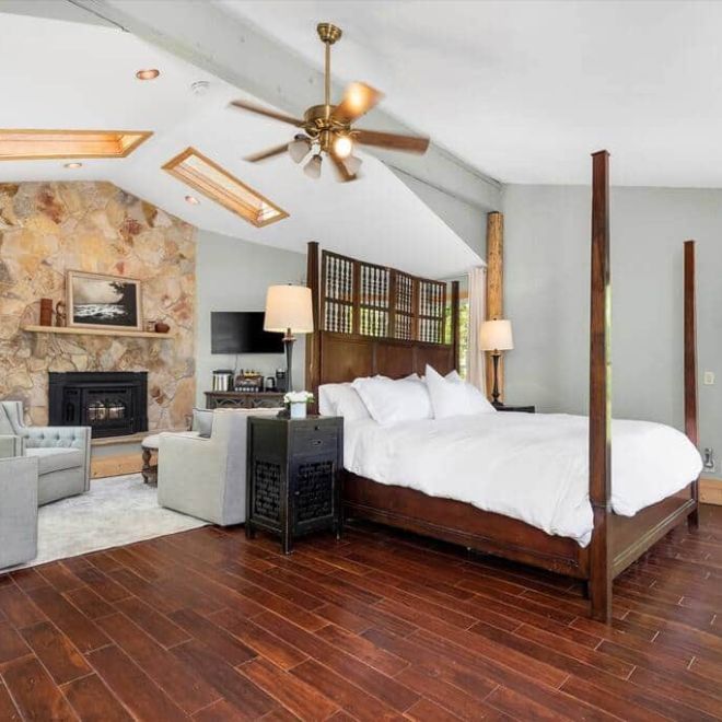 a living room filled with furniture and a fireplace