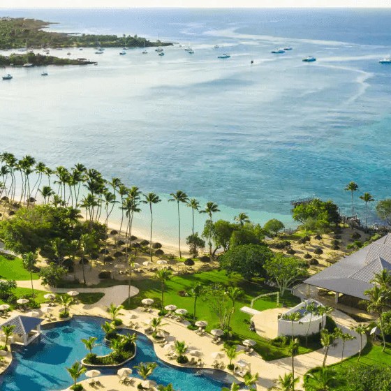 a large body of water with a city in the background