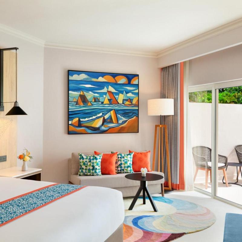 a living room filled with furniture and a flat screen tv