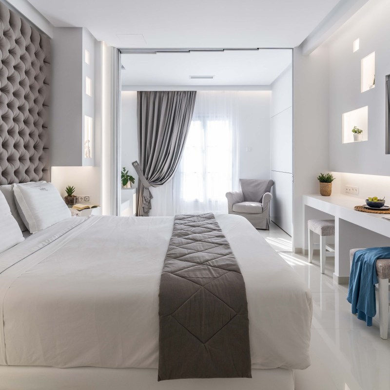 a bedroom with a large bed in a room