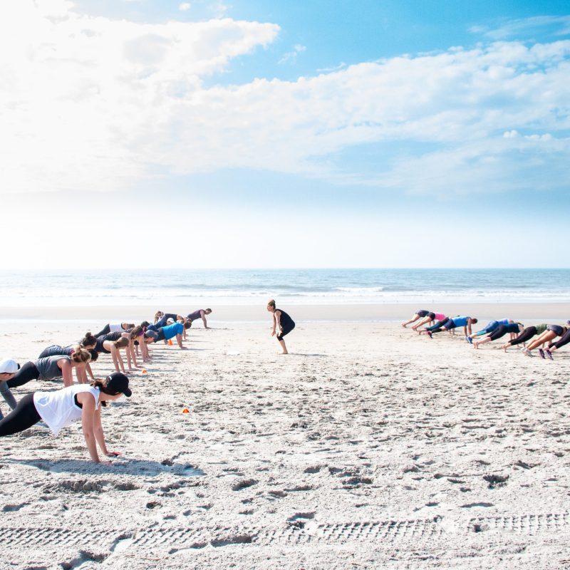a group of people on a beach