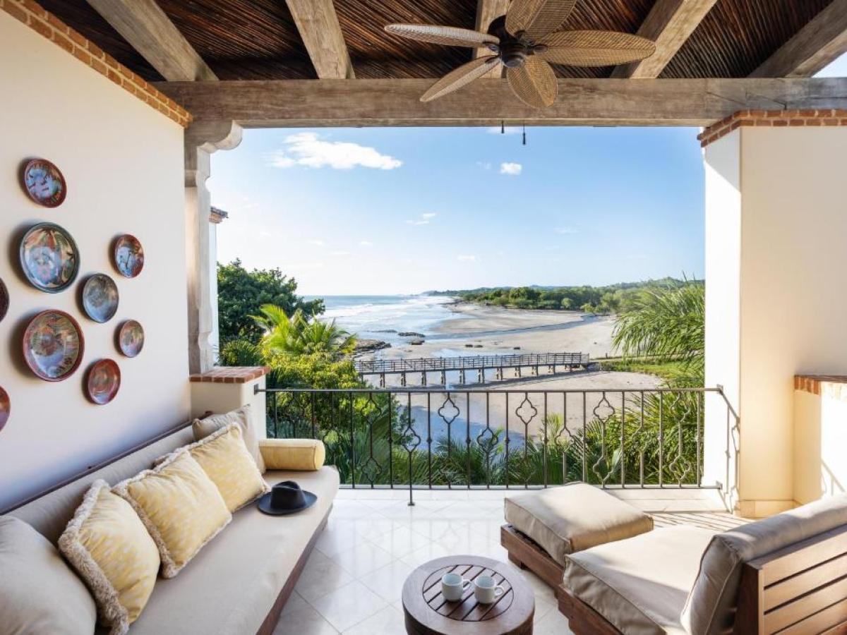 a living room filled with furniture and a fireplace